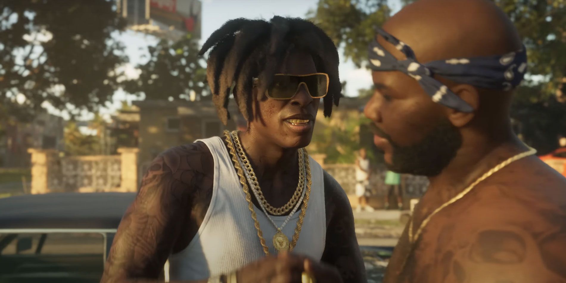 Man shaking the hand of another man wearing gold chains.