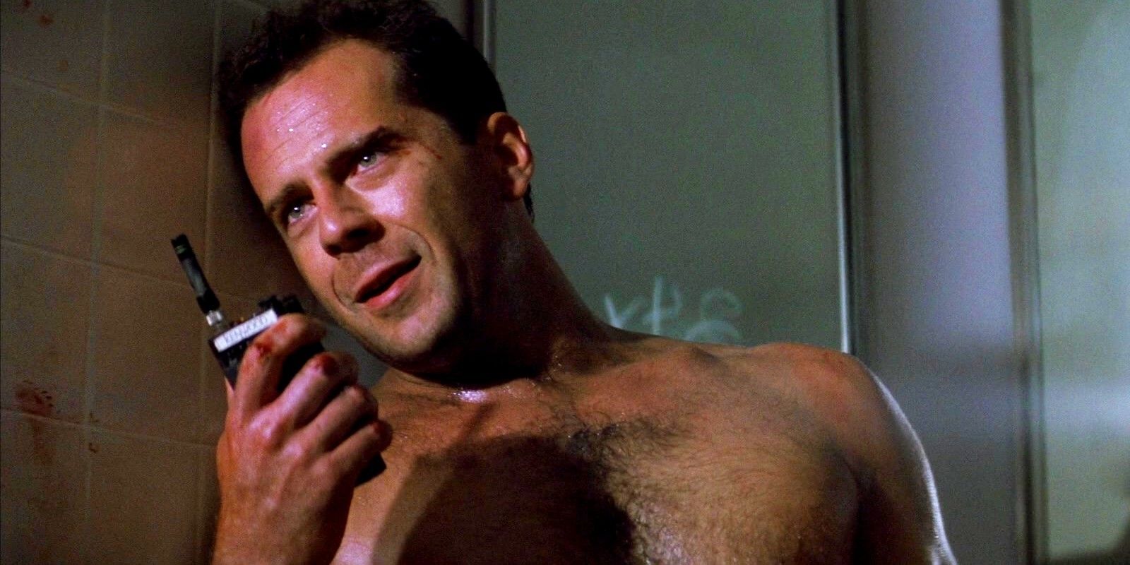 Bruce Willis talking to someone on a walkie talkie in Die Hard