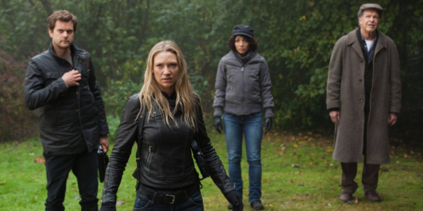 Olivia, Walter, Peter, and Astrid standing in the woods in season 5 of Fringe 