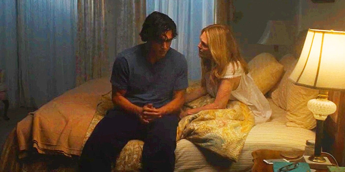 Charles Melton and Julianne Moore sitting on a bed in May December