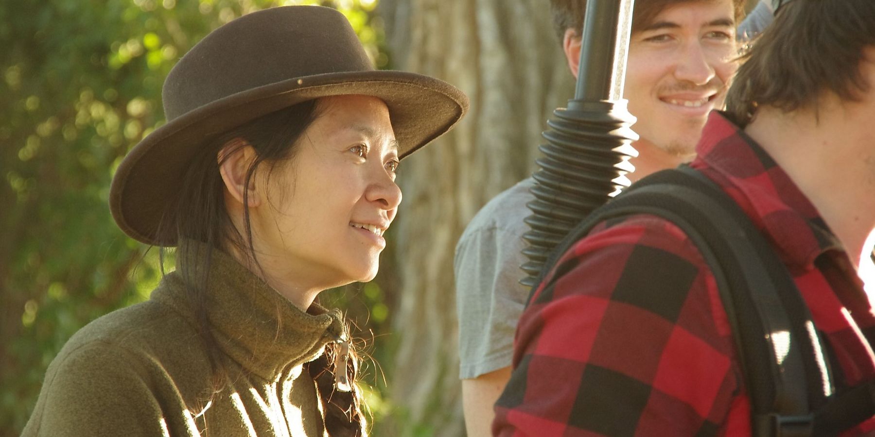 Chloe Zhao wearing a hat on the set of Eternals 