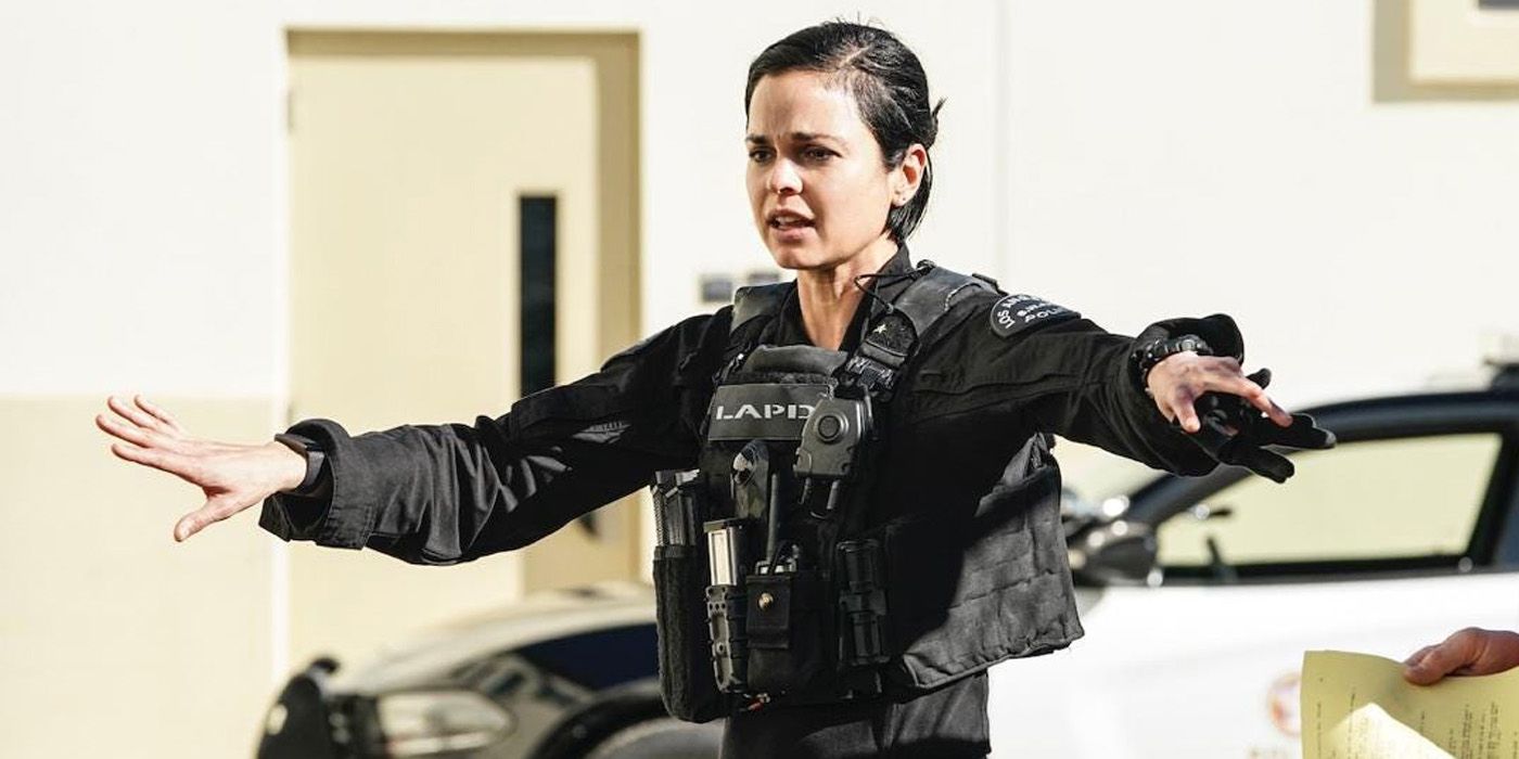 Chris holding her arms out on SWAT