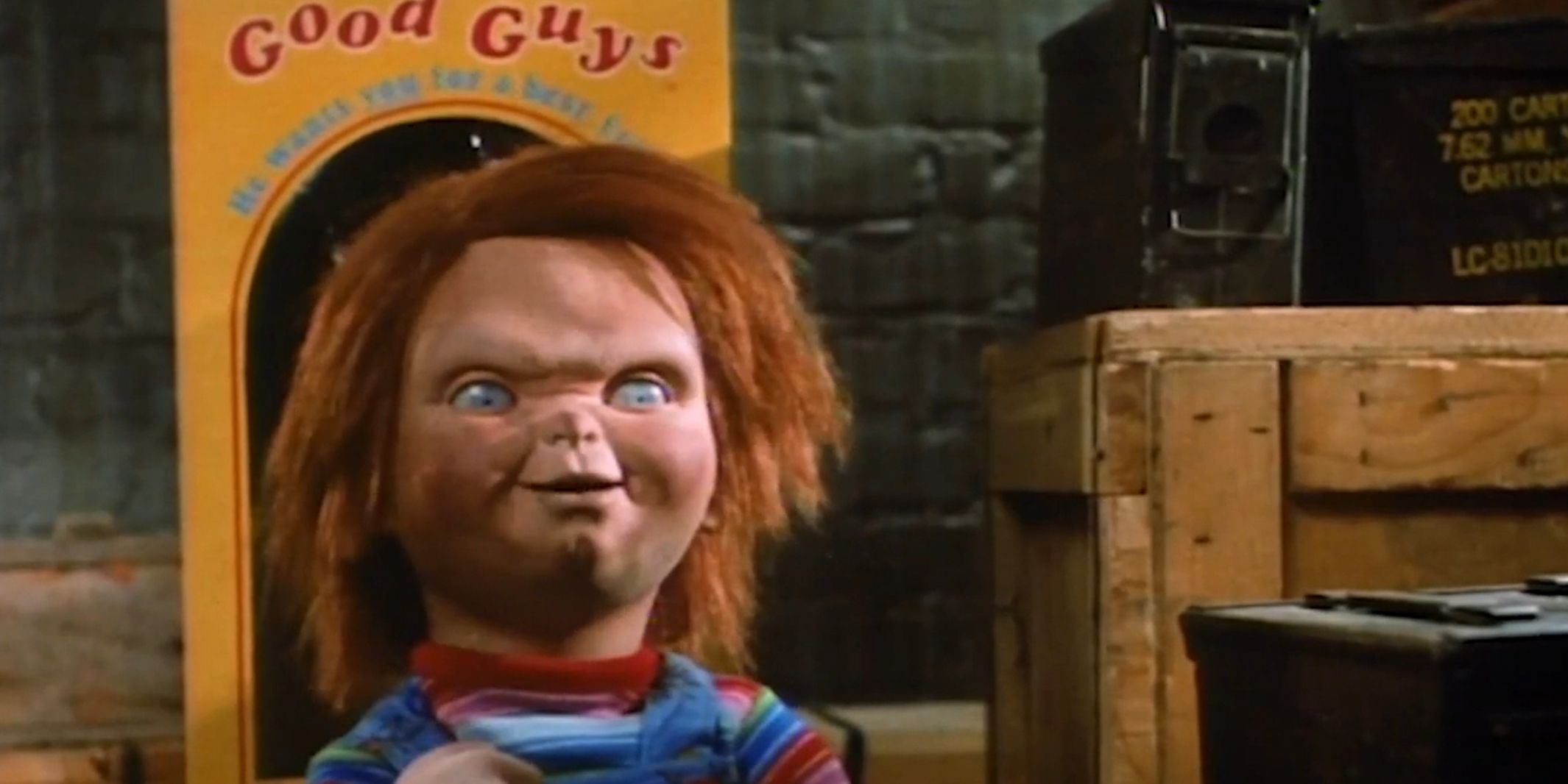 Chucky in front of a Good Guy box in the storage area in Childs Play 3