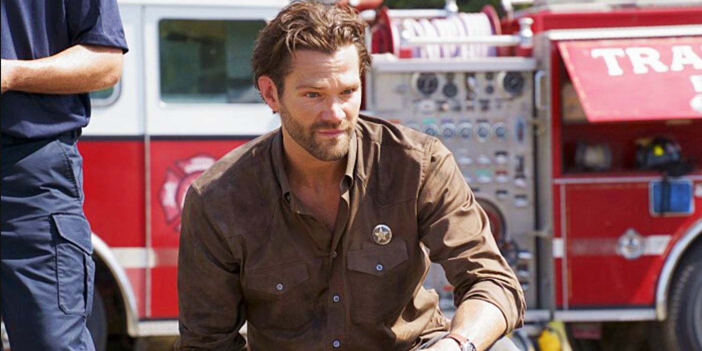 Cordell Walker (Jared Padalecki) kneeling down in front of a firetruck in Walker season 3
