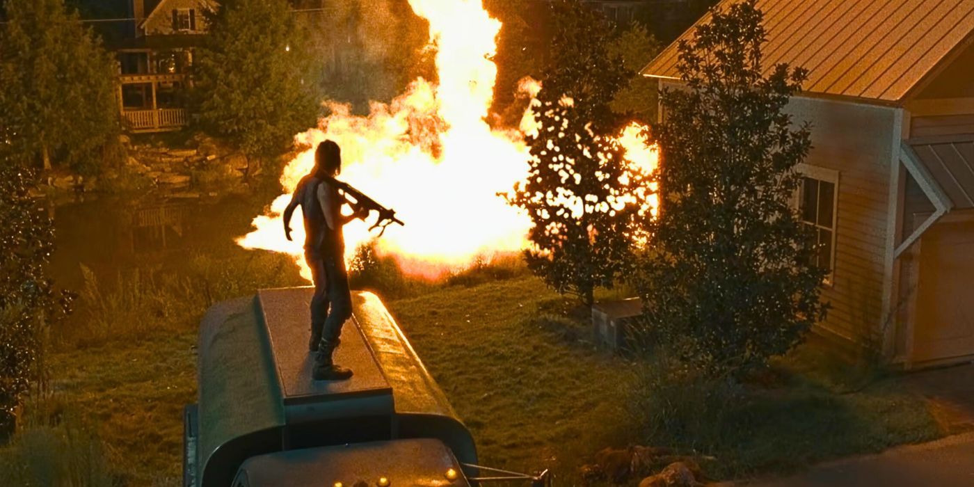Daryl (Norman Reedus) fires a rocket launcher in Alexandria to distract a horde in The Walking Dead