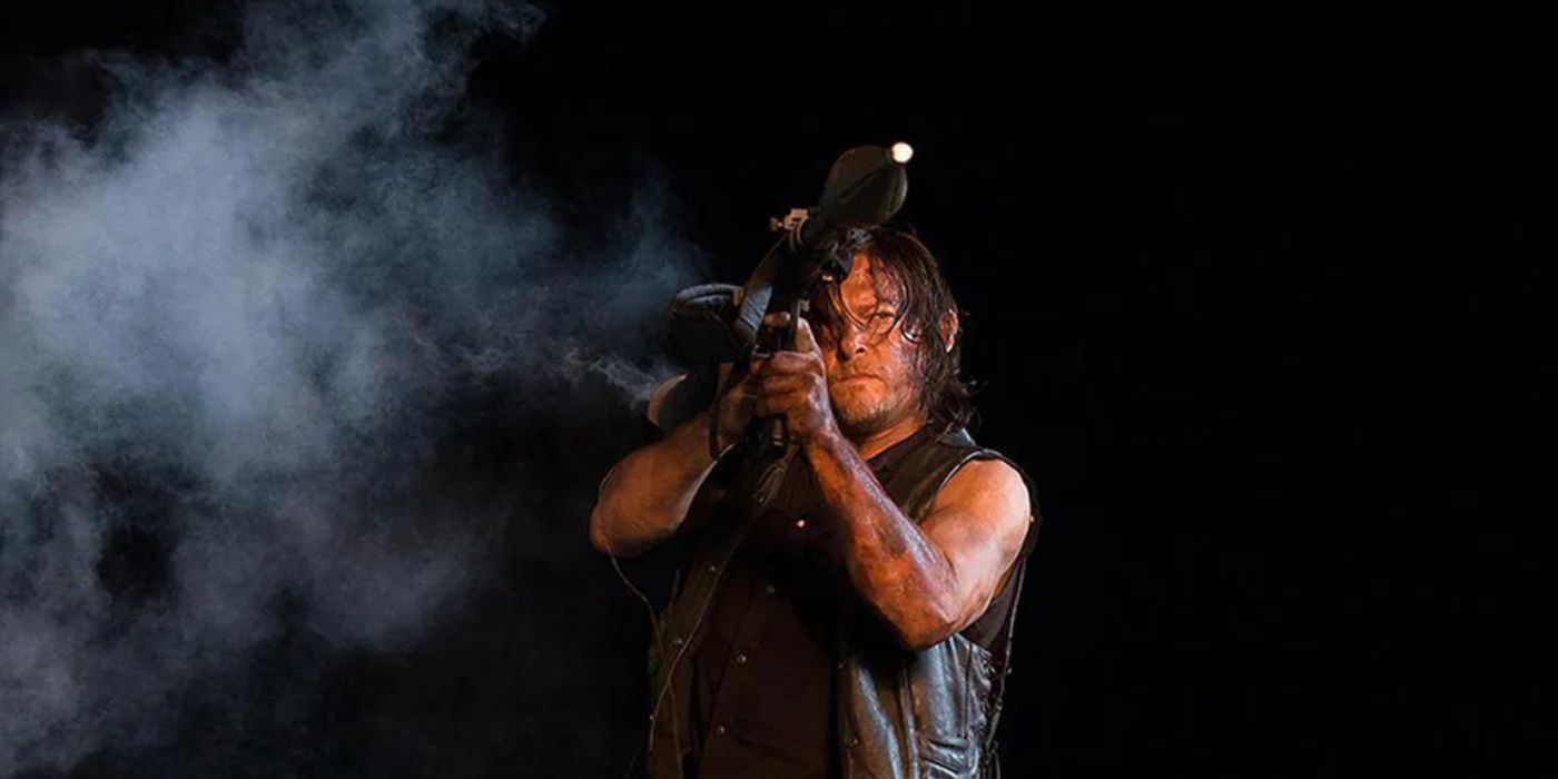Daryl (Norman Reedus) looks through the sight of a grenade launcher in The Walking Dead