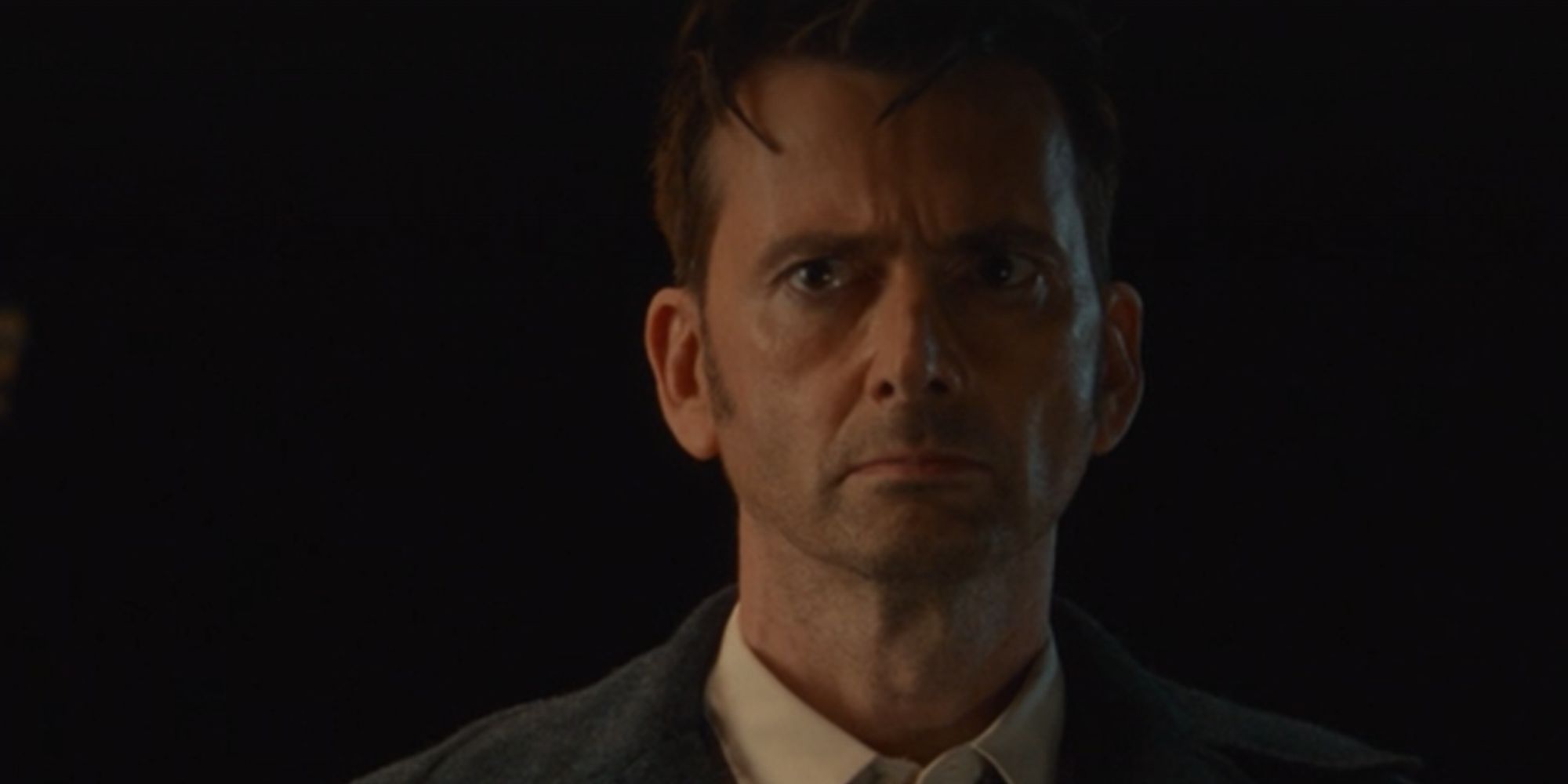 David Tennant as the Fourteenth Doctor looks confused in Doctor Who 60th Anniversary