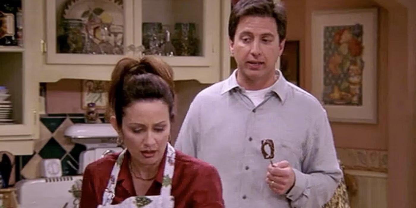 Ray is behind Debra in the kitchen in the Everybody Loves Raymond episode Christmas Present 