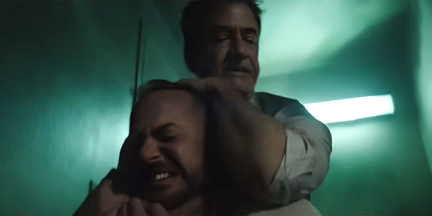 Dermot Mulroney as Harry holding guy in chokehold in Ruthless