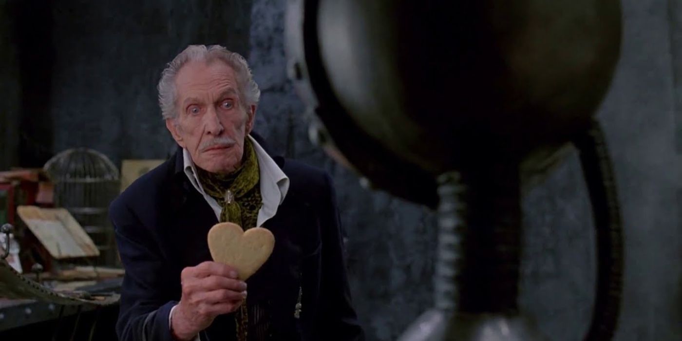 The Inventor prepares to put a Heart-Shaped Sugar Cookie Heart onto Edward's robotic skeleton in Edward Scissorhands