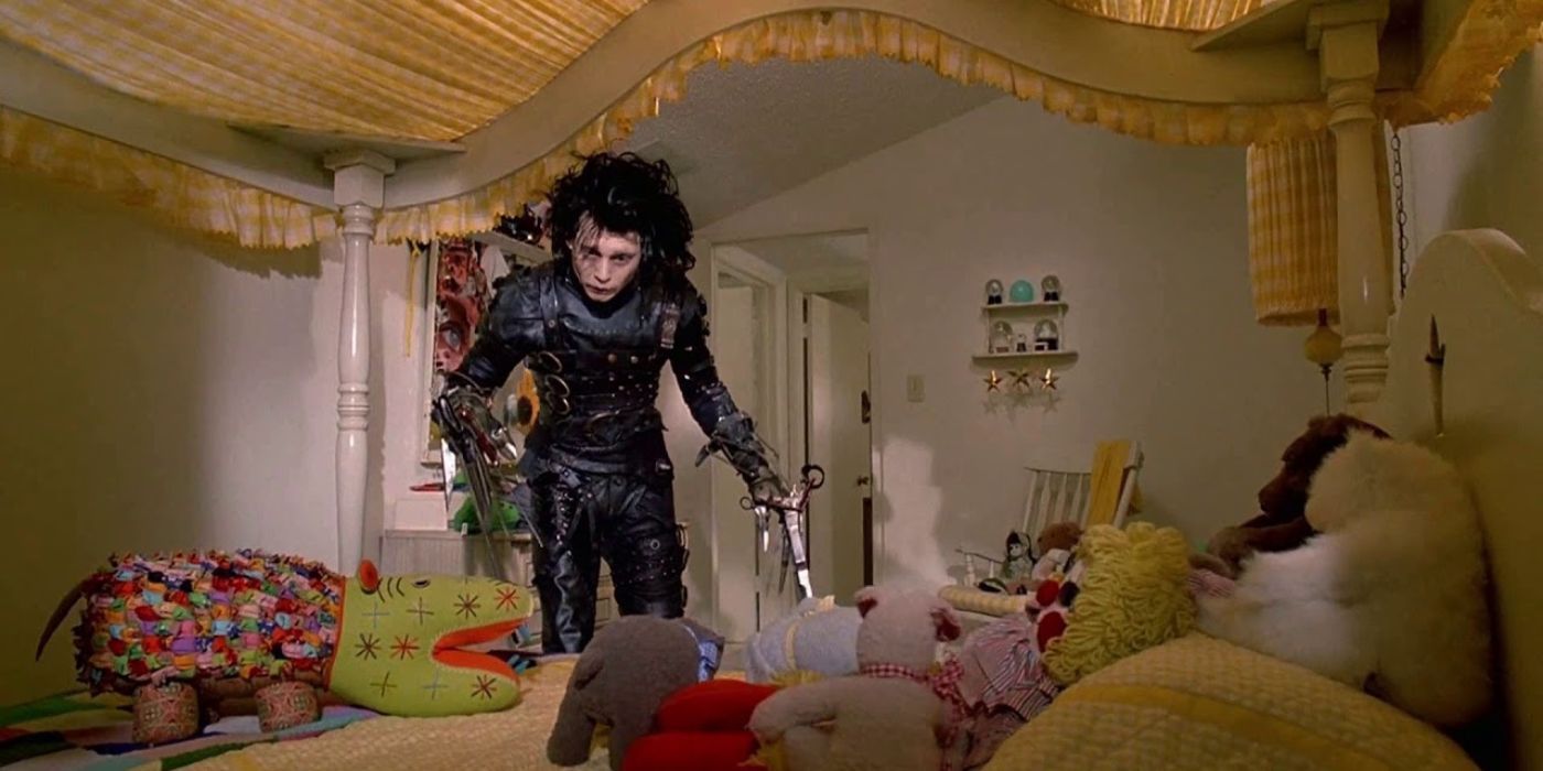 Edward is perplexed by the waterbed and the stuffed animals on top of it in Edward Scissorhands