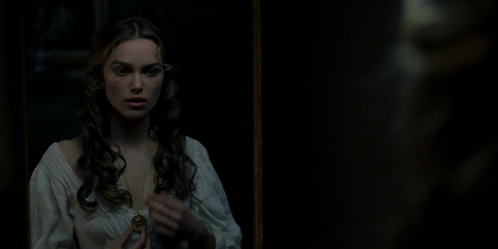 Elizabeth looking in a mirror in POTC Curse of the Black Pearl