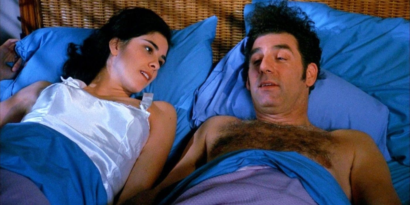 Emily (Sarah Silverman) lying in bed with Kramer (Michael Richards) in Seinfeld