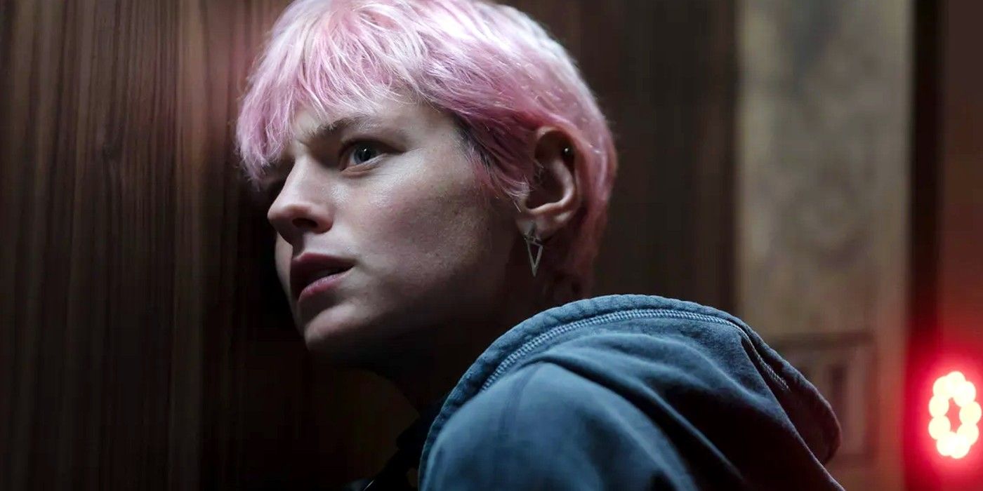 Emma Corrin listening through the door in A Murder at the End of the World