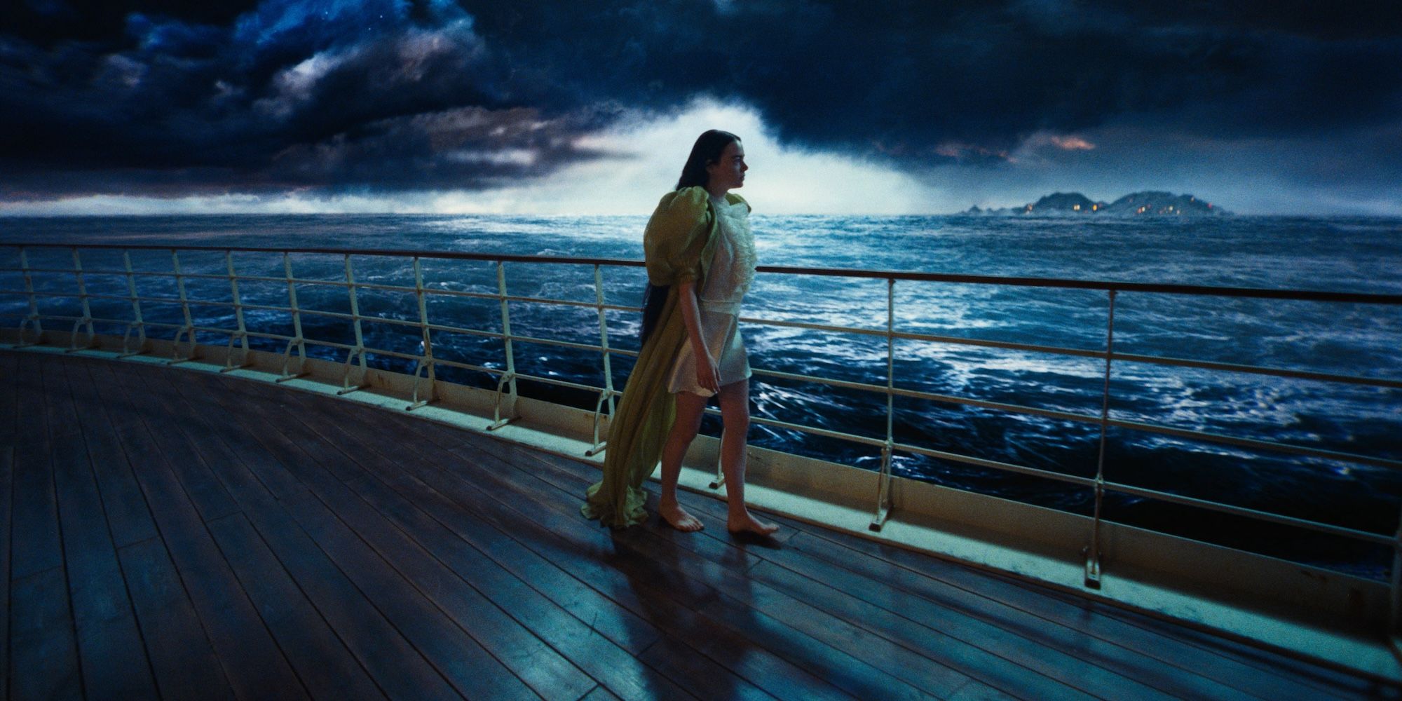 emma stone takes a stroll on a ship in poor things