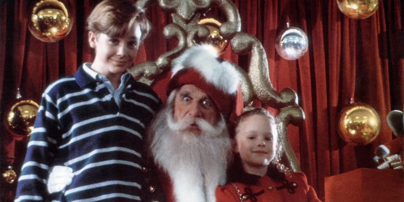 Ethan and Hallie posing with Santa in All I Want for Christmas