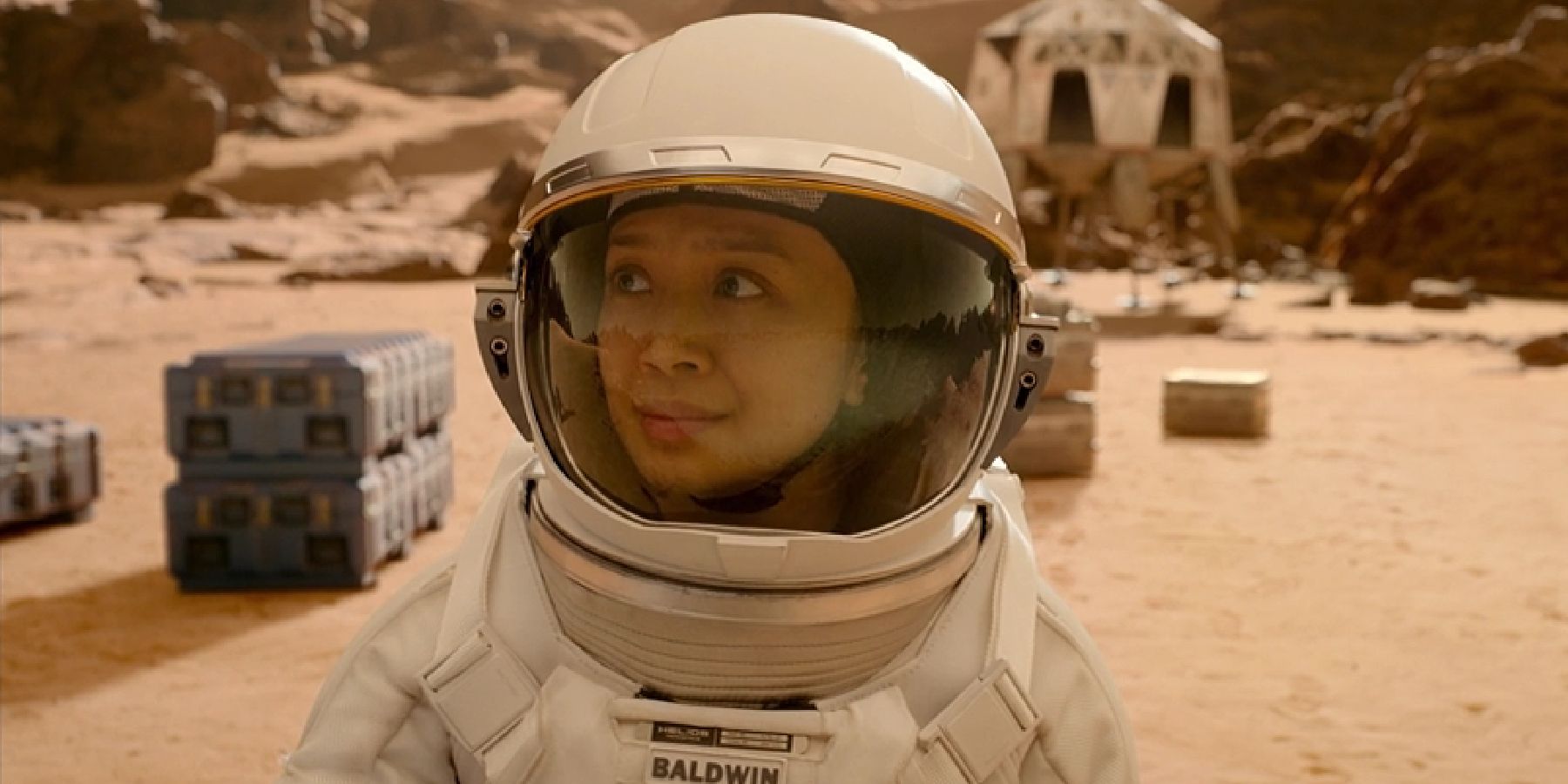 Kelly in a space suit on the Mars surface