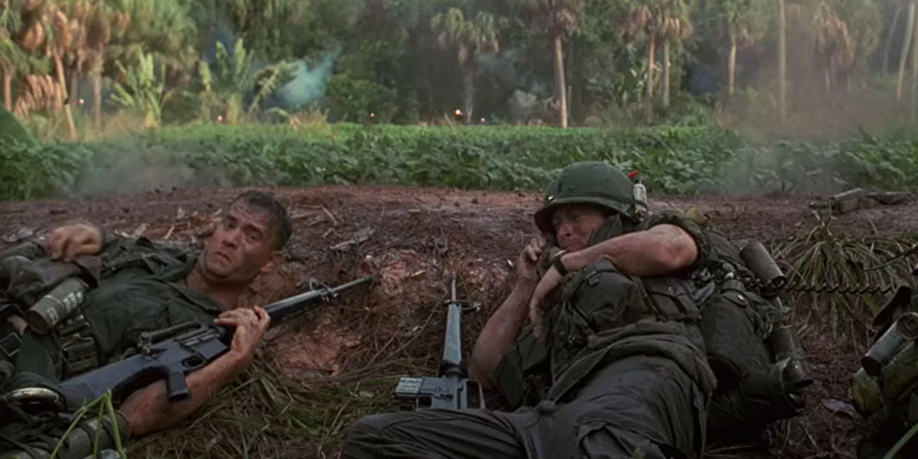 Forrest and other soldiers ducking in a fox hole in Vietnam in Forrest Gump