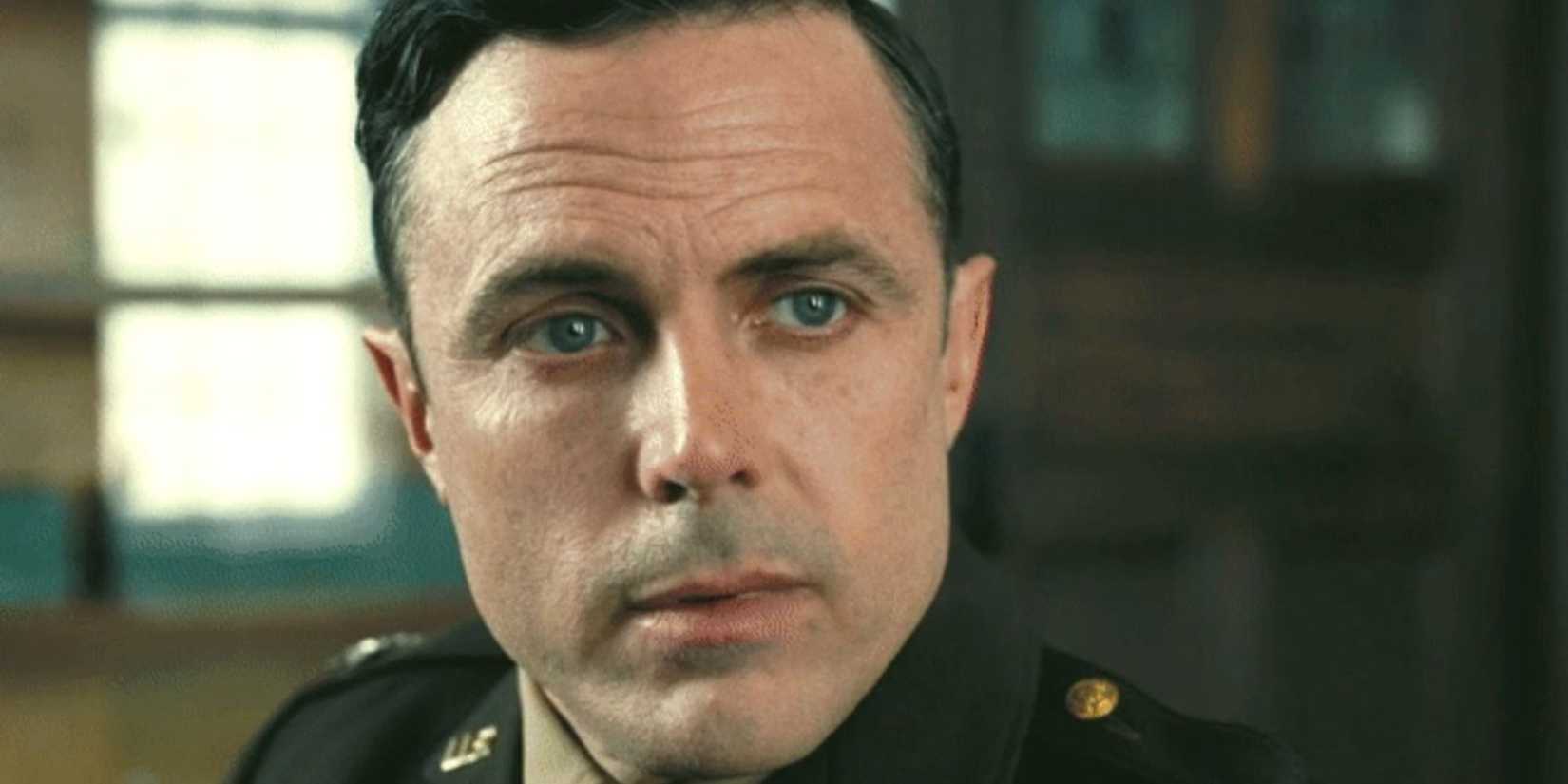 Casey Affleck as Boris Pash looking inquiringly in Oppenheimer