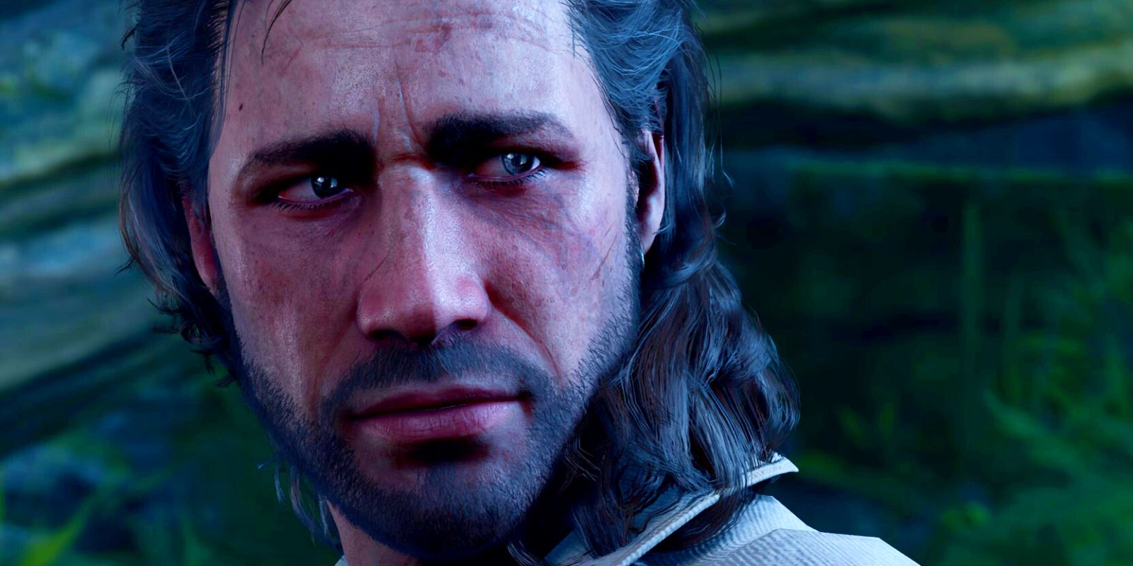 A close-up on Baldur's Gate 3 character Gale, a man with long, dark hair and a short beard, looking concerned.