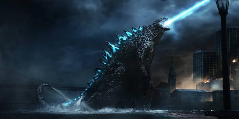 Godzilla standing in the ocean, blasting his atomic breath into the sky in the 2014 movie.