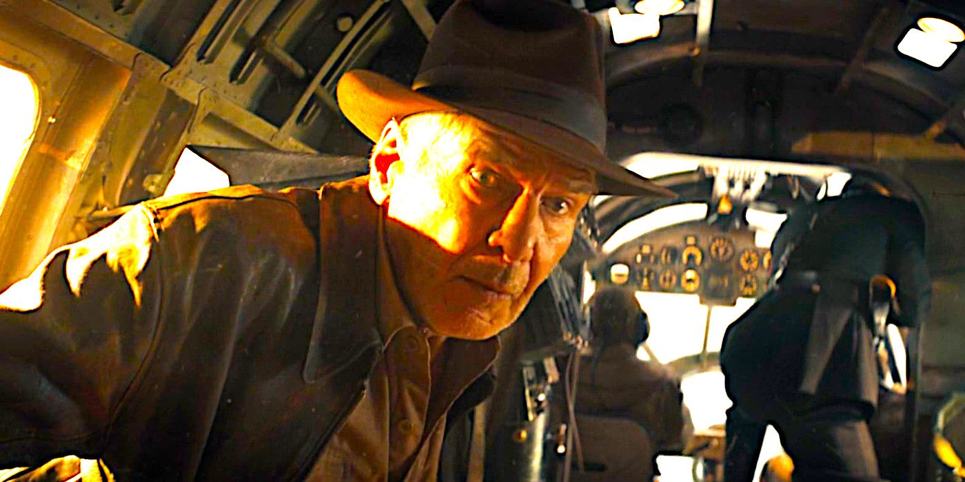 Harrison Ford wearing a shocked expression in an old fashioned bomber aircraft in Indiana Jones and the Dial of Destiny