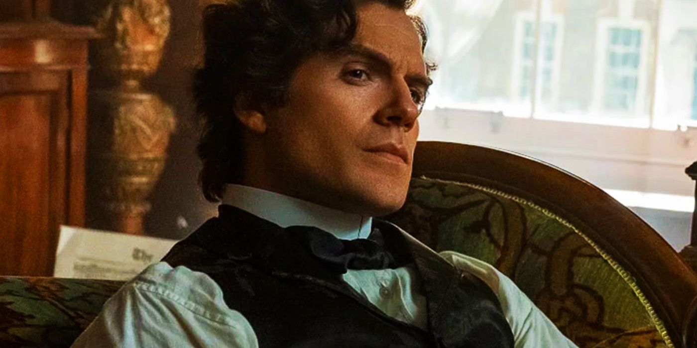 Henry Cavill as Sherlock Holmes leaning back on a couch in Enola Holmes