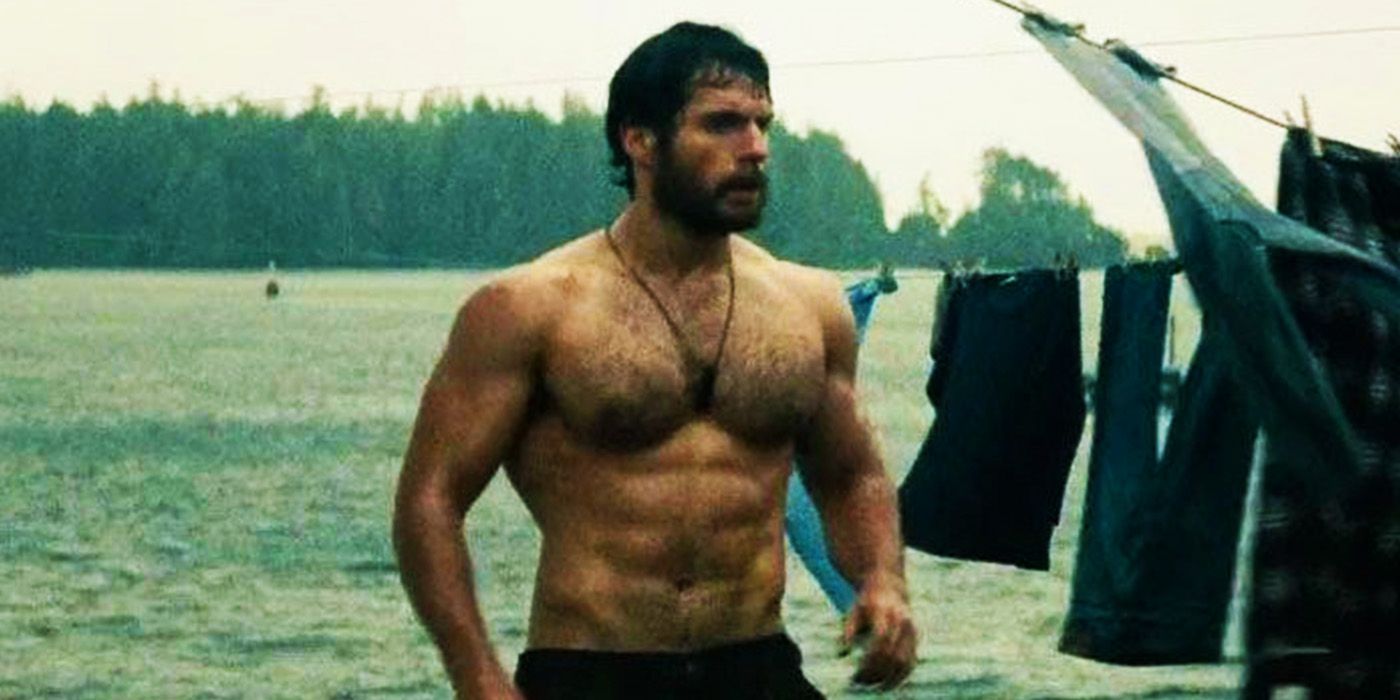 Henry Cavill topless and looking sideways as Clark Kent in Man of Steel