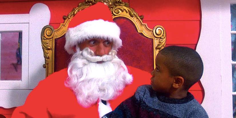 Hulk Hogan's Blake Thorn dressed as a Mall Santa exchanges a concerned look with a small child in Santa With Muscles