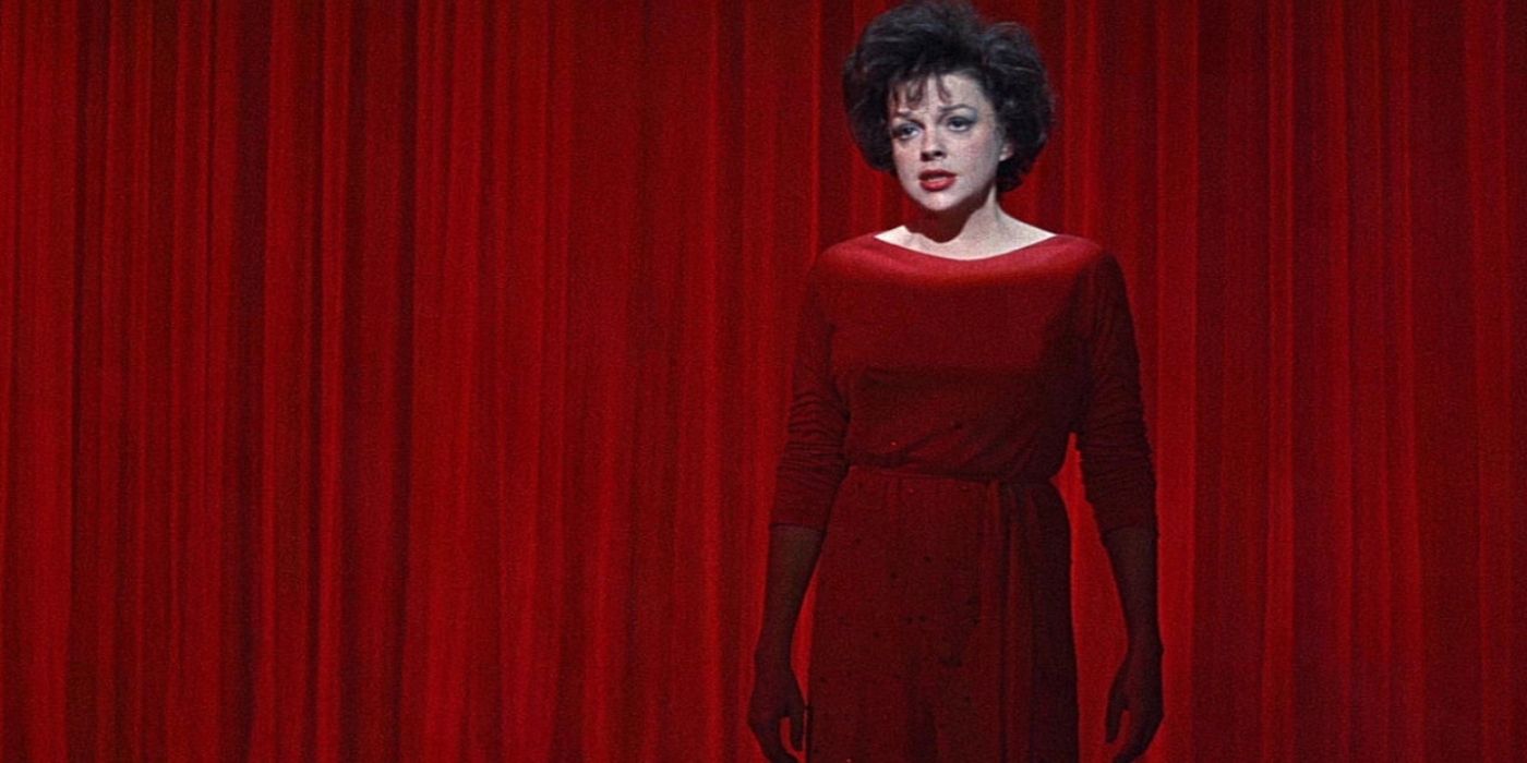 Judy Garland singing in a red dress in I Could Go On Singing 