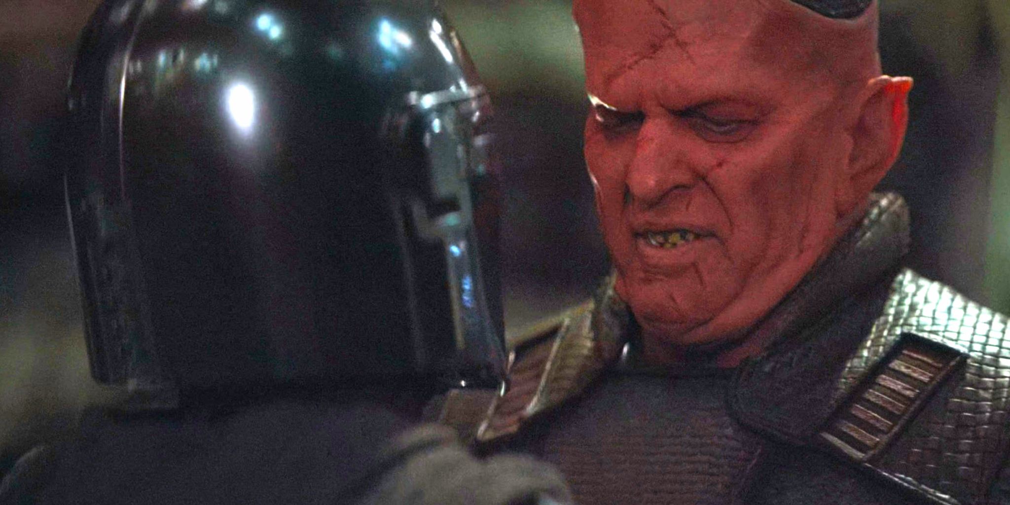Din Djarin is sized up by the Devaronian Burg in The Mandalorian sesaon 1, episode 6