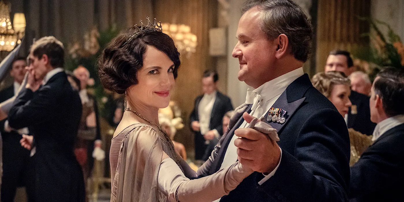 Cora smiling at the camera while she dances with Robert on Downton Abbey.