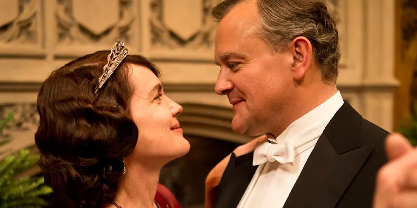 Robert and Cora Crawley are looking at each other and smiling on Downton Abbey.