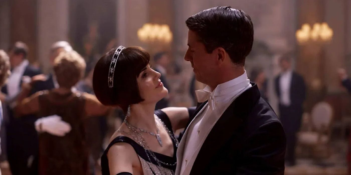 Lady Mary and Herny Talbot looking at each other while dancing in Downton Abbey.