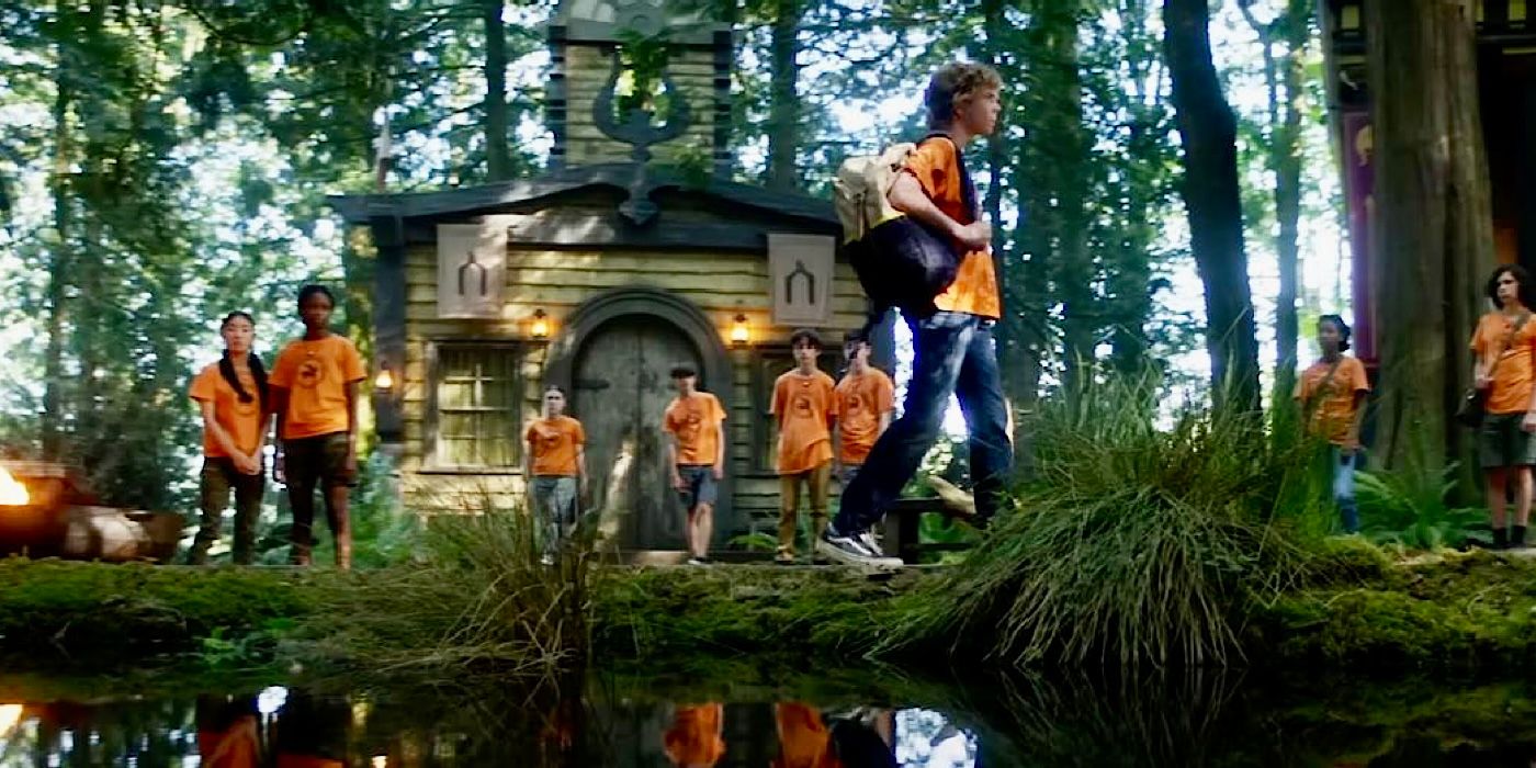 Percy walks with a backpack through Camp Half-Blood in Percy Jackson and the Olympians.