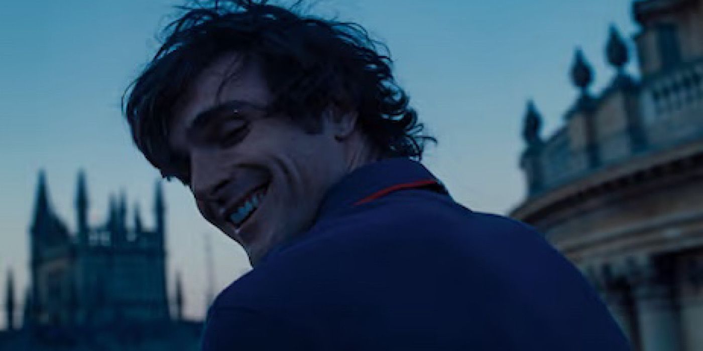 Felix Catton (Jacob Elordi) smiling while looking over his shoulder in front of his family's estate in Saltburn.