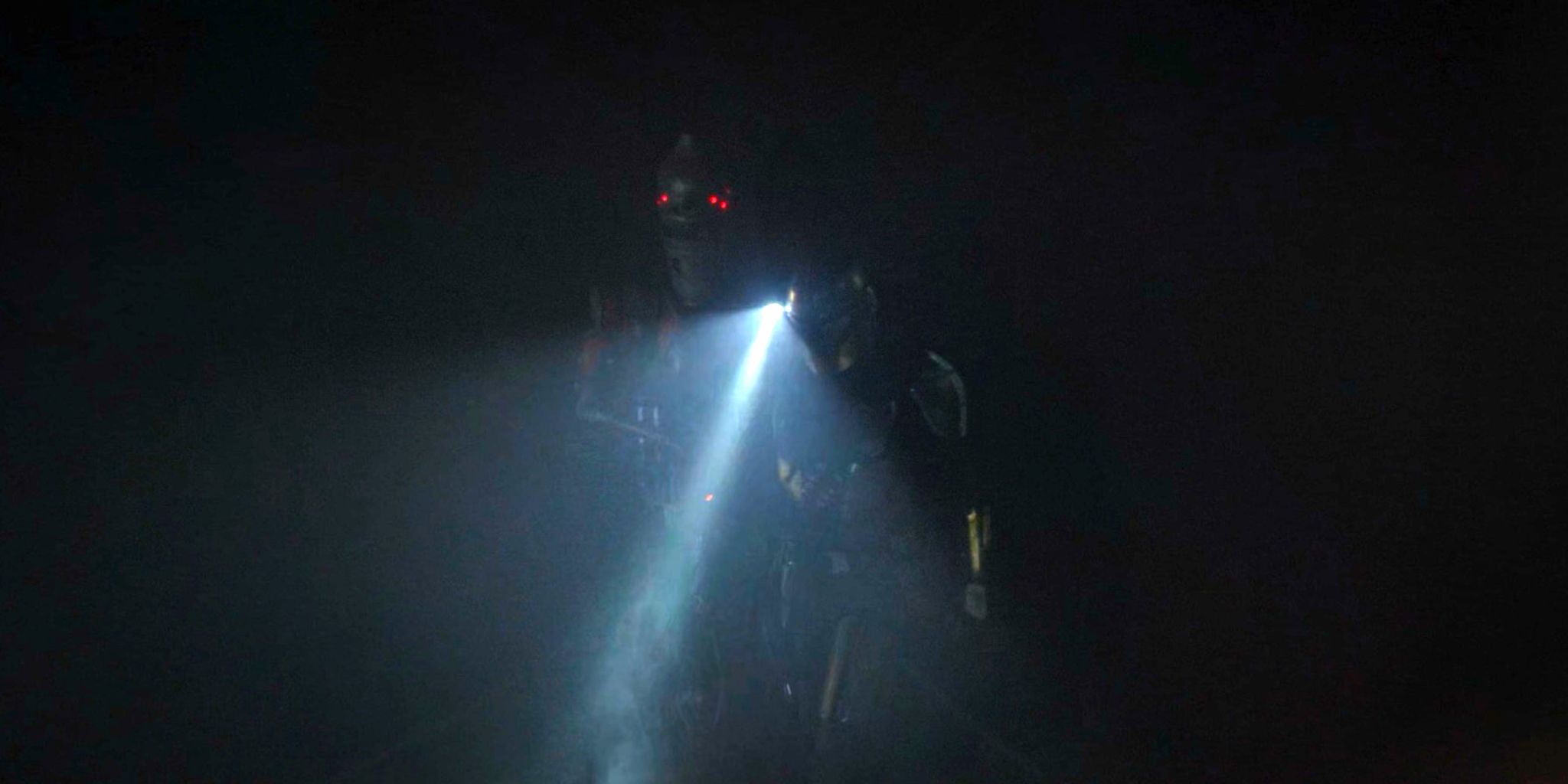 IG-11 supports Din Djarin in the Mandalorian tunnels of Nevarro in The Mandalorian season 1 finale