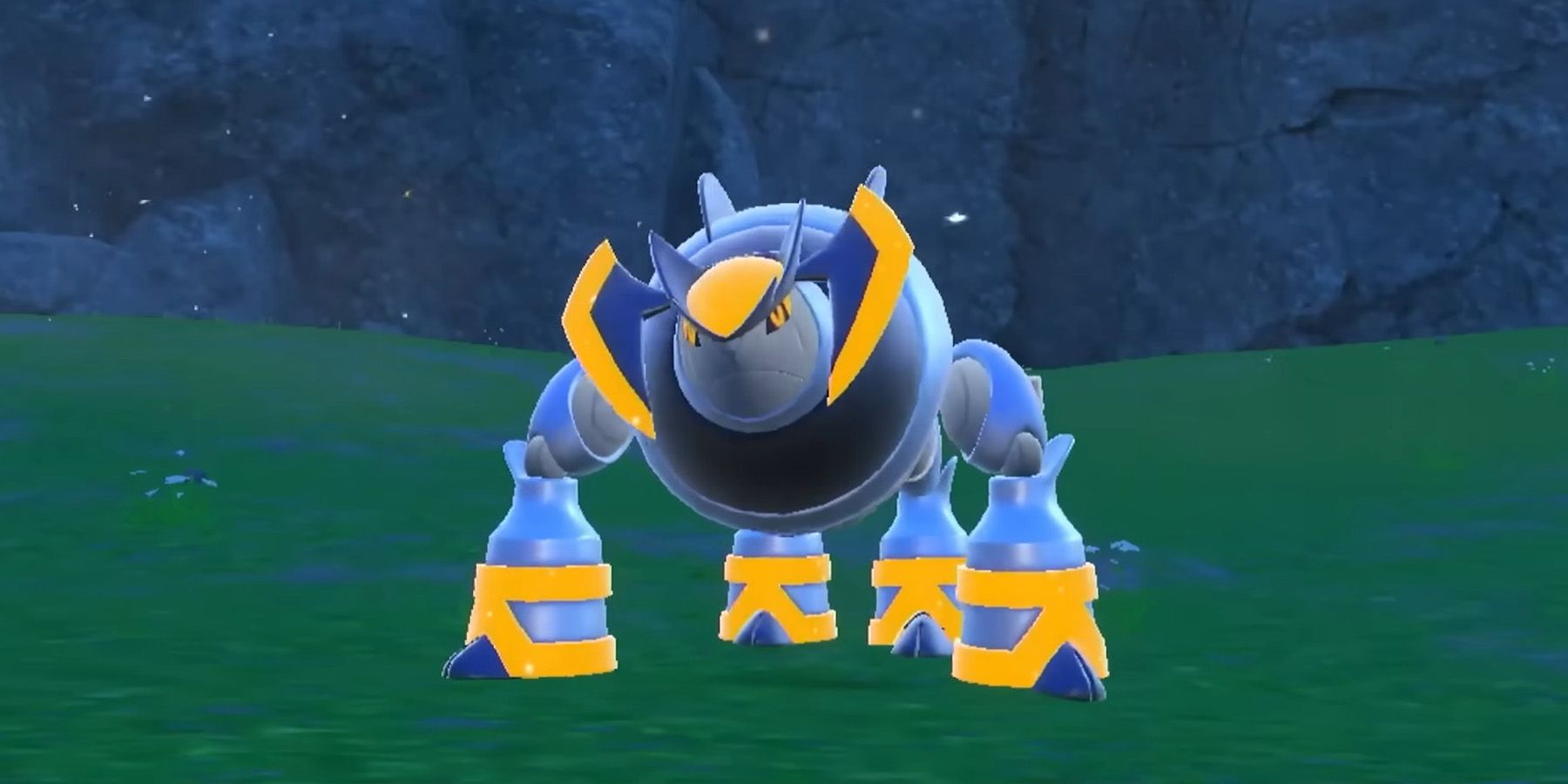 Iron Boulder em Pokémon Scarlet e Violet: The Indigo Disk, uma criatura metálica arredondada.