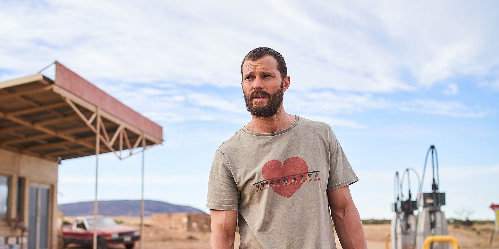 Jamie Dornan looking lost in the middle of the desert in The Tourist
