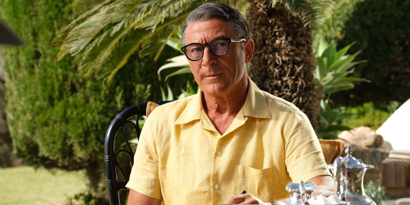 Jason Isaacs as Cary Grant in a yellow shirt in Archie