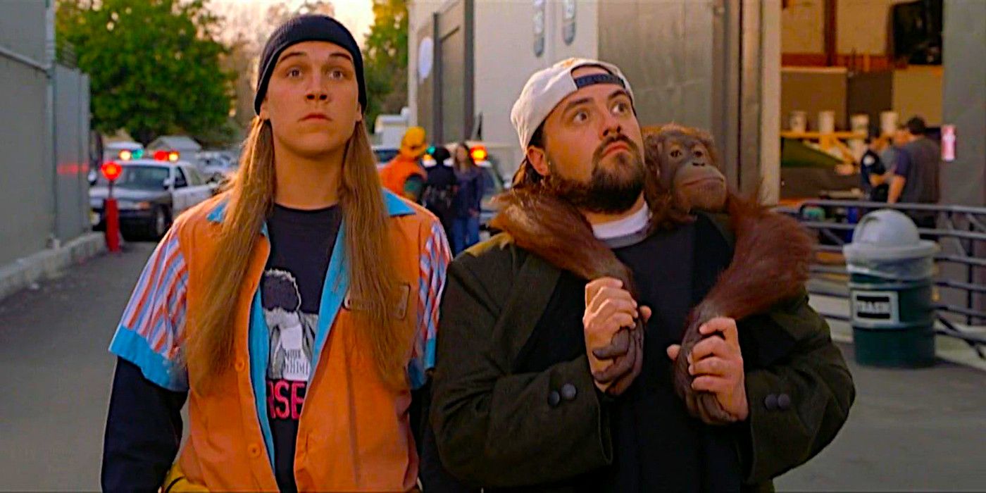 Jason Mewes as Jay and Kevin Smith as Silent Bob walking down an alley looking around in astonishment while Silent Bob carries an orangutan on his back in a funny scene fromin Jay and Silent Bob Strike Back