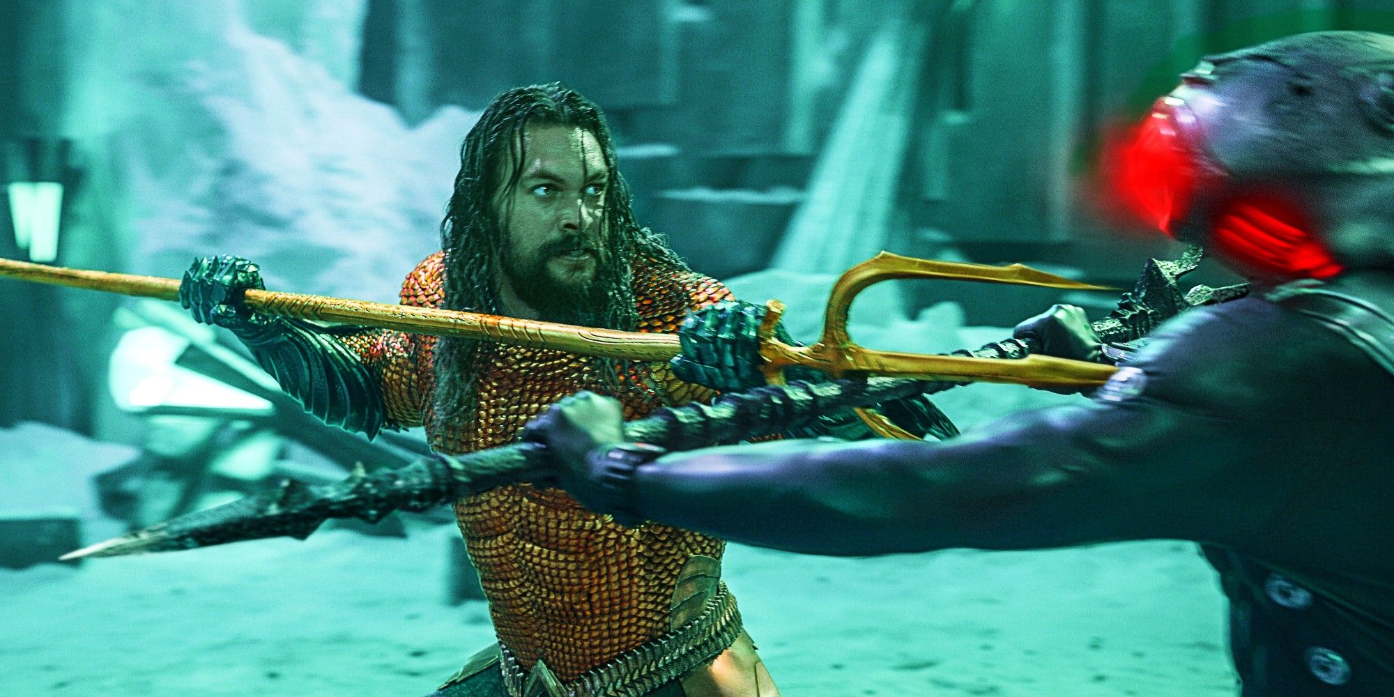 Jason Momoa As Aquaman Clashing Tridents With Yahya Abdul-Mateen II As Black Manta In A Cave In Aquaman and the Lost Kingdom