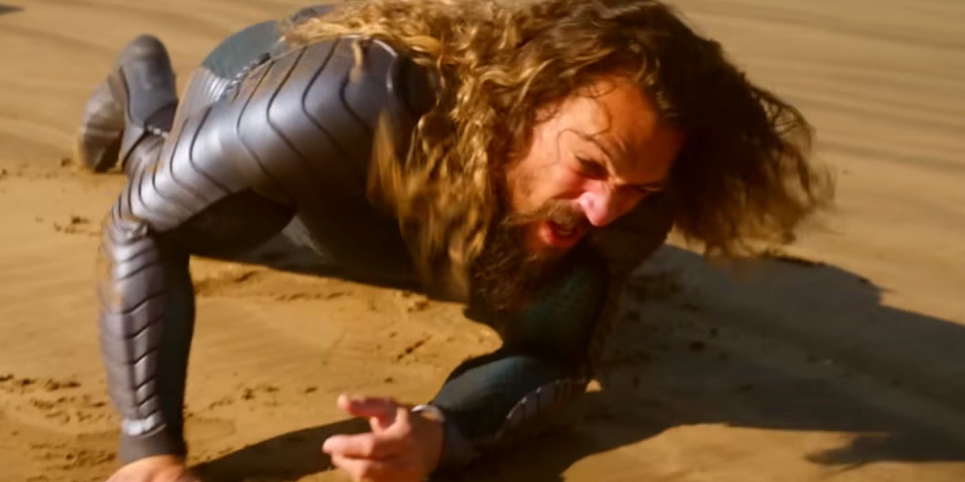 Jason Momoa as Aquaman Falling on the Sand in Aquaman and the Lost Kingdom