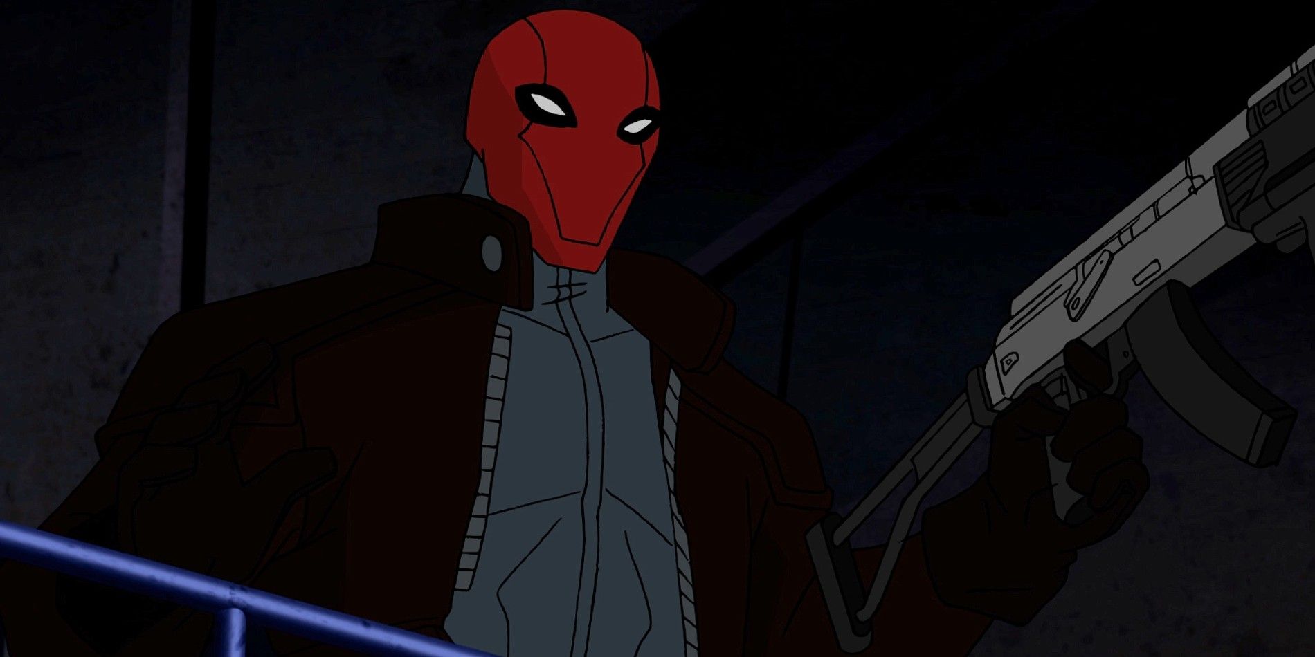 Jason Todd em sua fantasia de Capuz Vermelho segurando uma arma em Batman sob o Capuz Vermelho