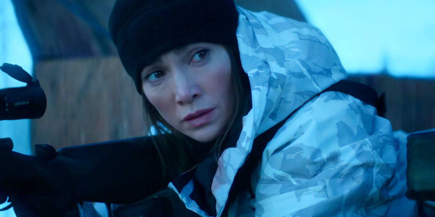 Jennifer Lopez as The Mother Wearing a Winter Coat and Holding a Gun in The Mother