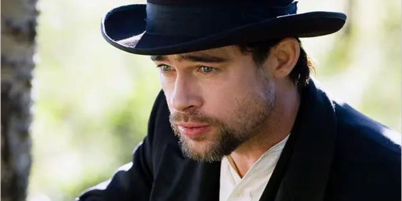 Brad Pitt as Jesse James looking pensive in a forest in a scene from The Assassination of Jesse James by the Coward Robert Ford