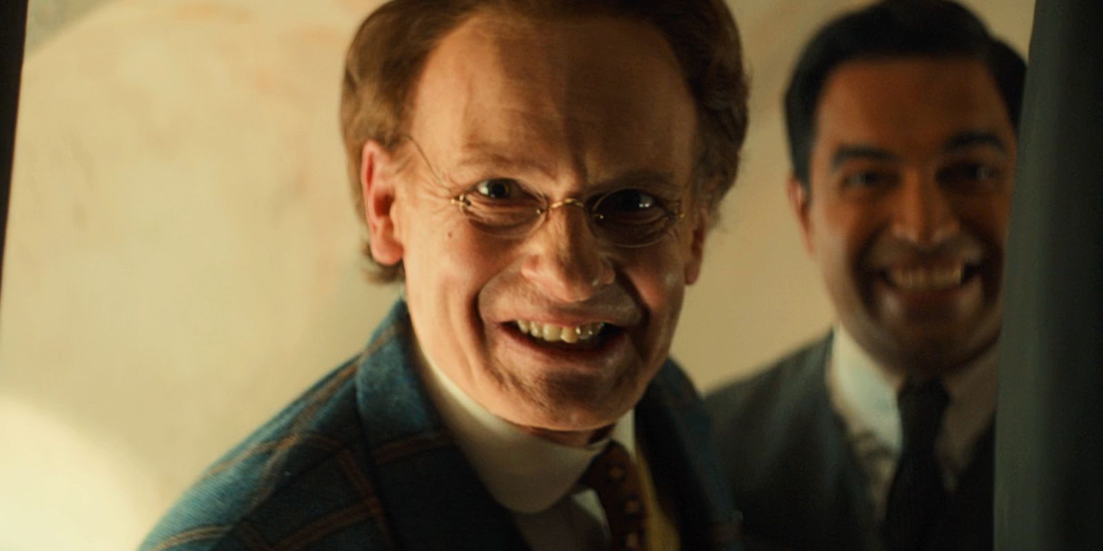 John Logie Baird and his assistant smile widely while looking into the TV box in Doctor Who.