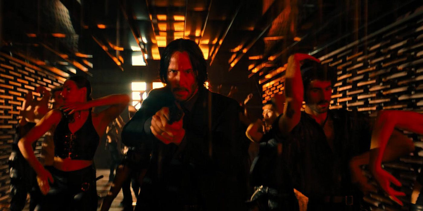 John Wick with a gun in the The Club Himmel und Hölle.