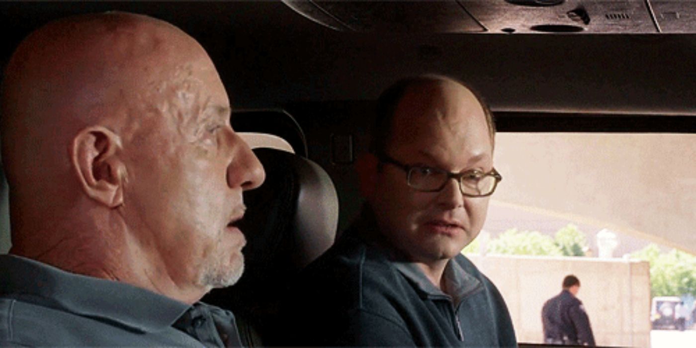 Jonathan Banks as Mike Ehrmantraut and Mark Proksch as Daniel Wormwald sit in a Hummer in Better Call Saul.