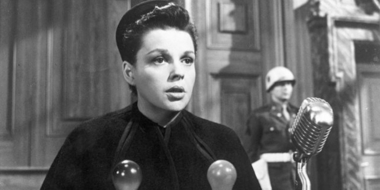 Judy Garland speaking into a microphone in Judgment At Nuremberg